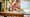 Image of a young girl sitting at a table and playing with Panda SKU 31165 