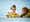 Image of a girl and a man on the floor building the new LEGO DUPLO PEPPA PIG set