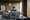 Lifestyle image of a man with brown hair building the LEGO® Star Wars™ Venator-Class Republic Attack Cruiser set on a table